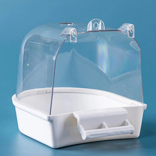 Clear plastic bird bath with white base and perch on blue background