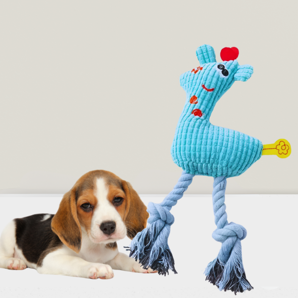 Blue plush dog toy with squeaker next to calm puppy – KnuffelGiraf