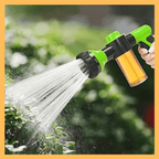 Handheld green adjustable spray nozzle for pet baths and gardening with soap dispenser