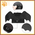Close-up of black bat wings pet costume with velcro strap, D-ring, and stitching details