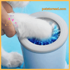 Closeup of dog paw in silicone paw cleaner with blue water, petstored.com branding