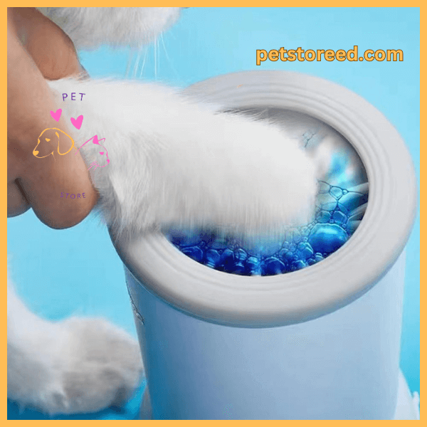 Closeup of dog paw in silicone paw cleaner with blue water, petstored.com branding