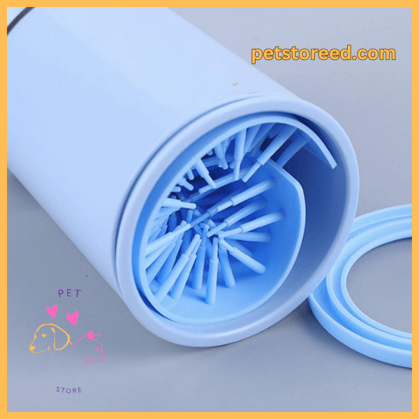 Blue silicone pet paw cleaner brush with lid, branded petstored.com, on grey background