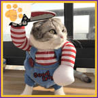 Cat in Chucky costume with striped shirt and overalls, holding fake knife indoors