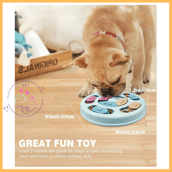 French bulldog using a blue dog puzzle feeder toy on wooden floor indoors