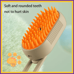 Cat grooming brush with orange soft bristles and rounded teeth for gentle pet care