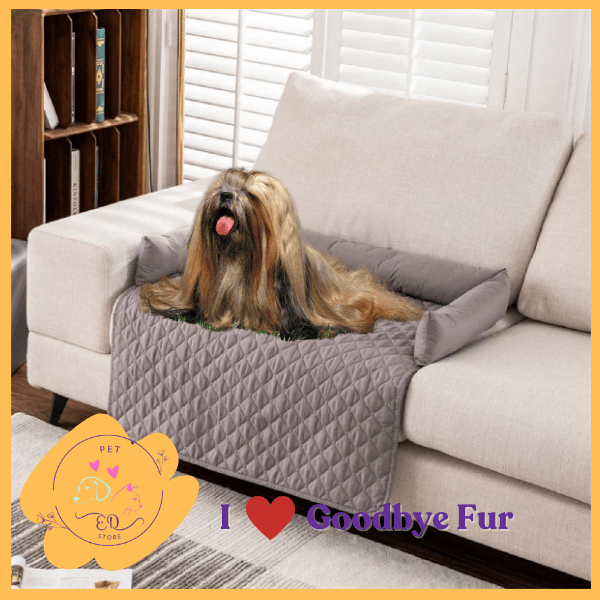 Long-haired dog relaxing on quilted Goodbye Fur sofa cover, luxury pet comfort product.