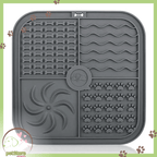 Grey silicone lick mat for slow pet feeding with paw and bone patterns