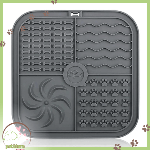 Grey silicone lick mat for slow pet feeding with paw and bone patterns