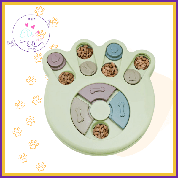 Paw-shaped interactive puzzle feeder for dogs with kibble, pastel colors, and bone motifs.