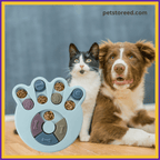Cat and dog sitting beside interactive paw-shaped puzzle feeder with kibble, petstoreed.com