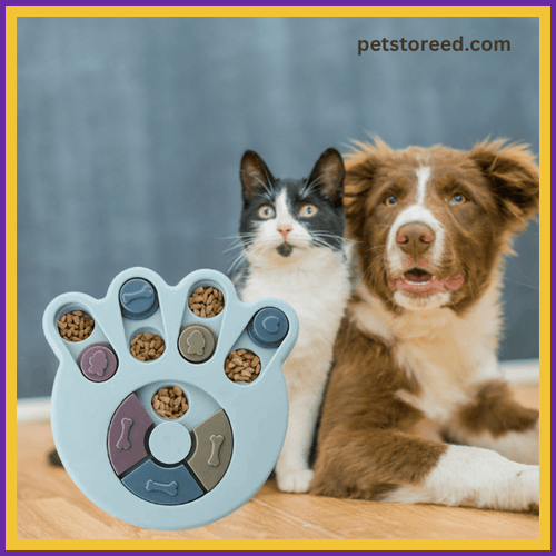 Cat and dog sitting beside interactive paw-shaped puzzle feeder with kibble, petstoreed.com