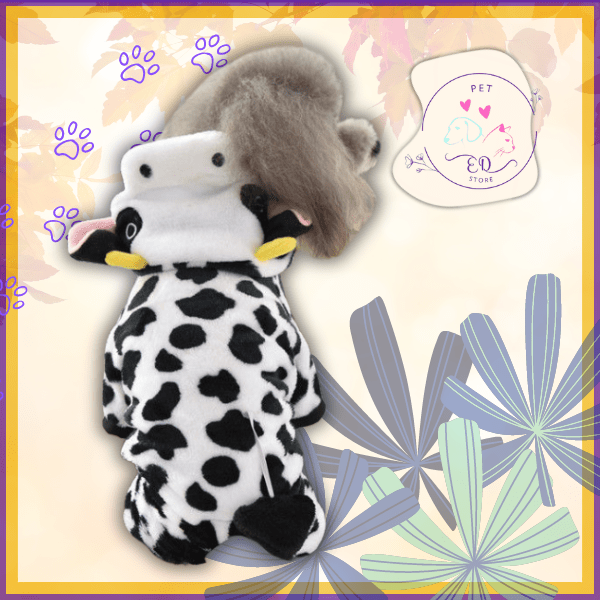 Small dog wearing cozy cow print costume on pastel floral pet store background