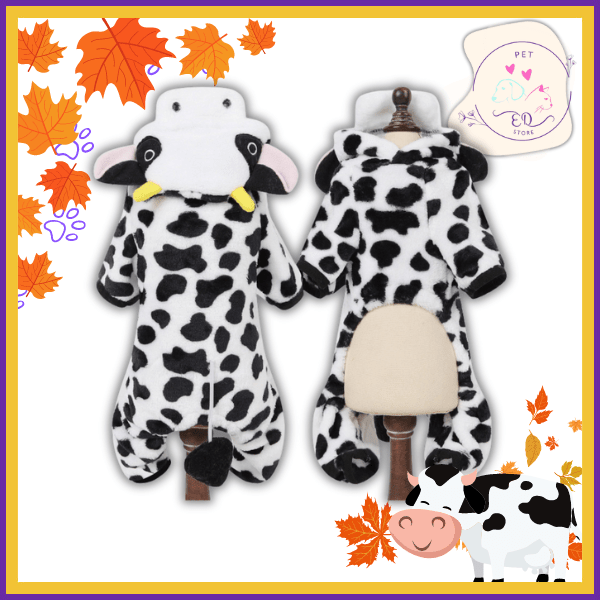 Plush cow print dog onesie costume on display mannequins, autumn leaves background.