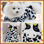 Fluffy dog wearing cow print pet costume with cute ears and horns, shown from multiple angles.