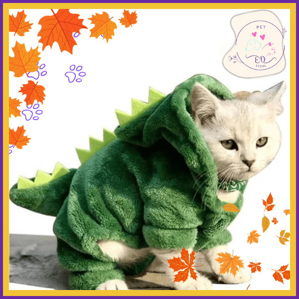 White cat in green dinosaur costume, autumn leaves, Pet EQ Store logo, cute pet outfit
