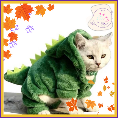 Green dinosaur costume for cat with hood on grey pet, perfect for Halloween pet outfit ideas