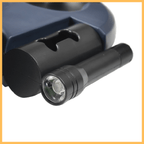 Black flashlight and mount attached to a dark blue device, close-up product photo