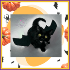 Black cat in bat costume on Halloween-themed background with pumpkins and bats