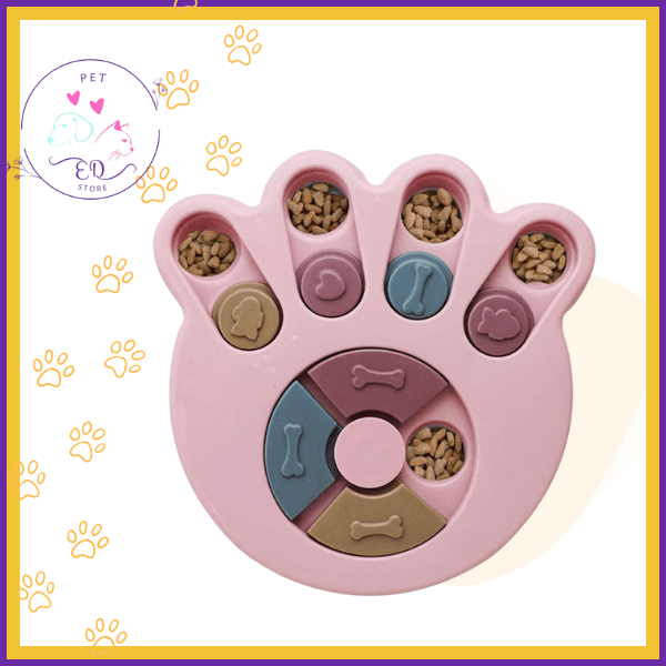 Pink paw-shaped pet puzzle feeder with kibble, interactive slow feeding toy for pets