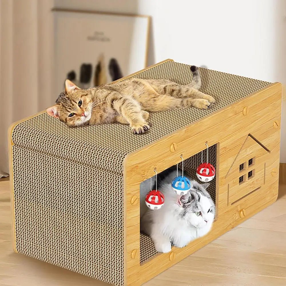 Two cats on a wooden cat house with scratching pad and hanging toys, indoors