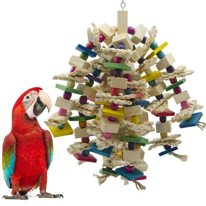 Colorful parrot toy with wooden blocks, rope, and beads next to a red parrot