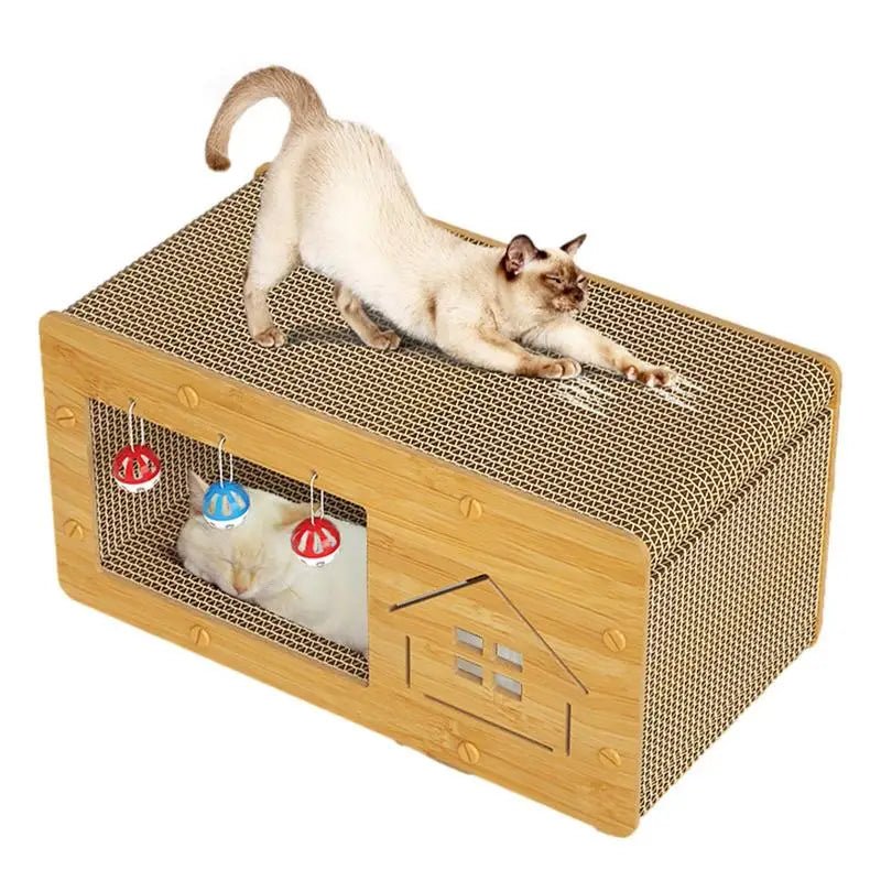 Cat stretching on cardboard cat house with scratching surface and toys, another cat inside.