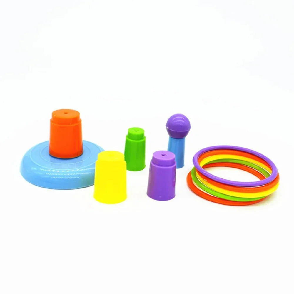 Colorful plastic ring toss game set with stackable pegs on a white background.
