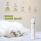 White cat peacefully sleeping beside a quiet MewooFun pet hair clipper, noise level comparison chart.