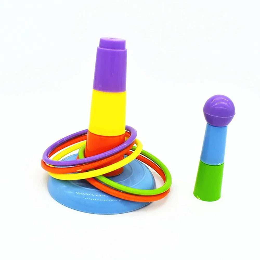 Colorful plastic ring toss game with stacked cones and multicolored rings on white background