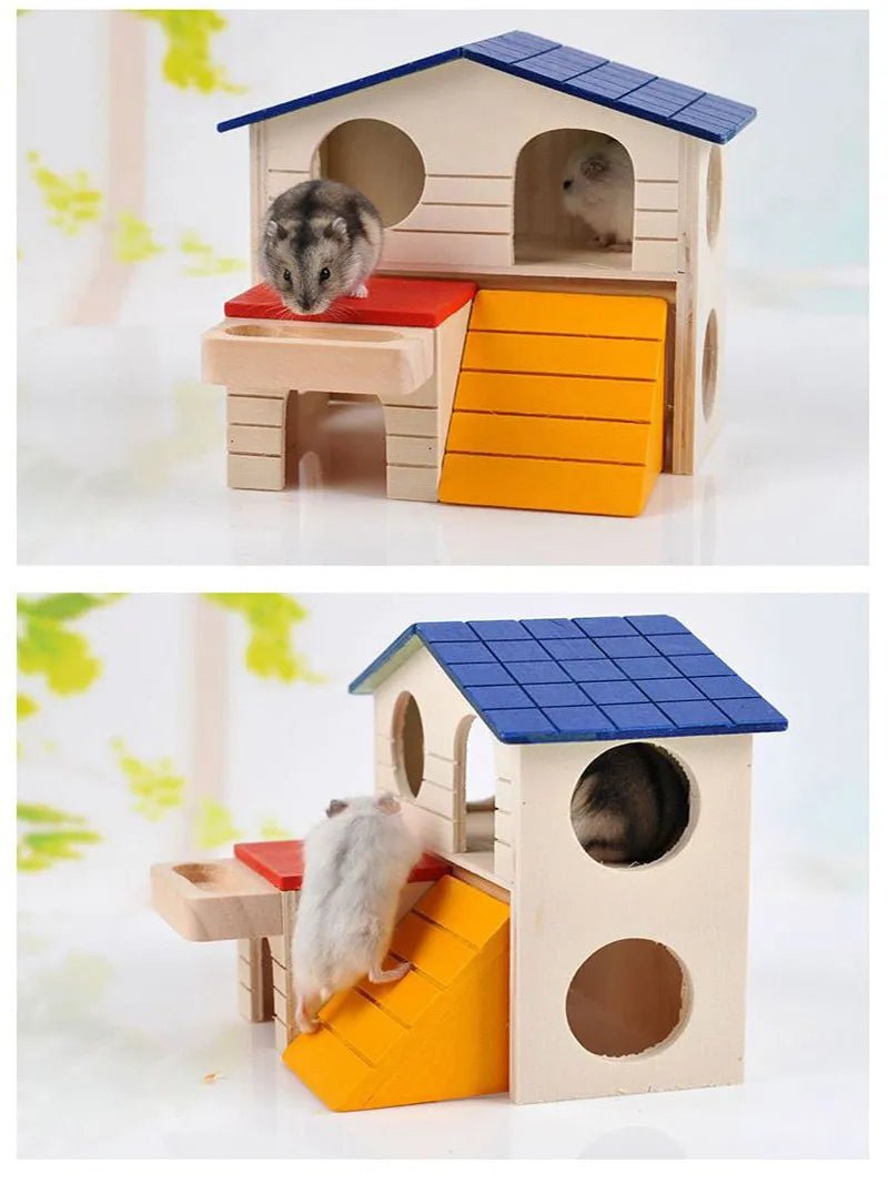 Wooden hamster house with blue roof, yellow ramp, and hamsters playing inside and outside