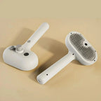 White pet grooming brush with self-cleaning mechanism on beige background