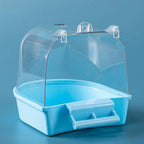 Blue plastic bird bath with clear dome cover on blue background