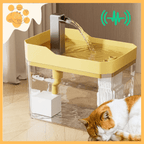 Silent Flow pet water fountain with yellow top and clear tank, cat sleeping beside.