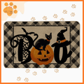 Halloween cleaning mat with BOO text, black cat, jack-o'-lantern, spider, and witch hat