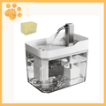 White ultra-clean pet water fountain with clear tank and flowing spout, sponge above