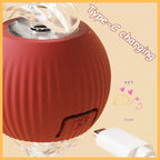 Red pet toy ball with Type-C charging port and white USB-C cable on beige background