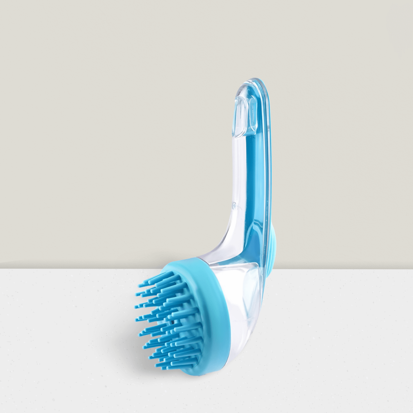 Blue pet bath brush with silicone bristles on a light background, pet grooming tool