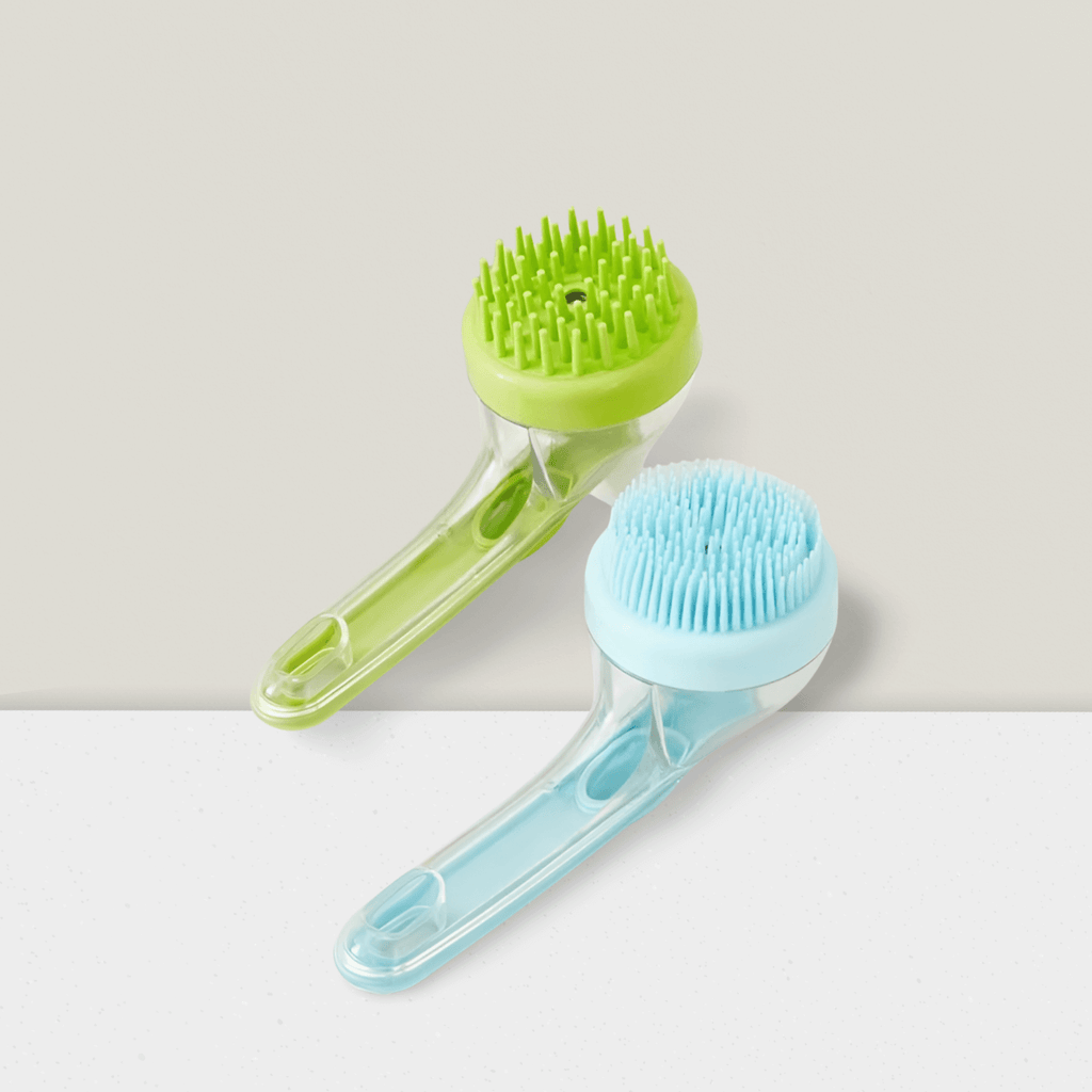 Blue and green silicone pet bath brushes with long handles on a neutral background