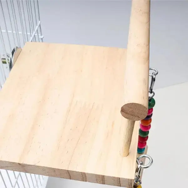 Close-up of wooden parrot toy with secure mount