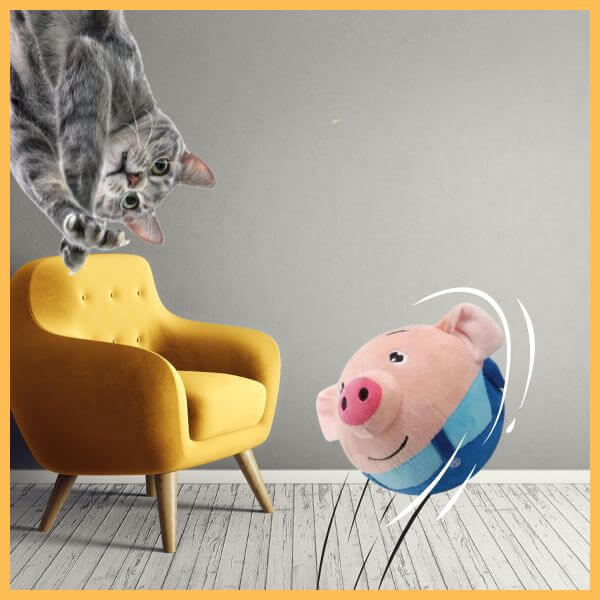 Gray cat playing with plush pig toy in modern living room with yellow chair