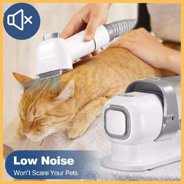 Cat being groomed with a silent low noise pet clipper, cat grooming tool in use.