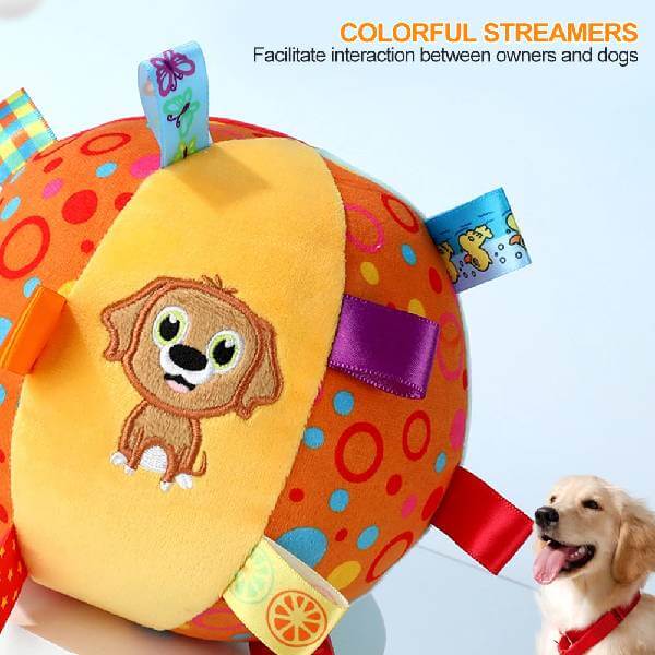 Colorful dog toy ball with streamers, cartoon puppy face, and happy dog in pet store setting.
