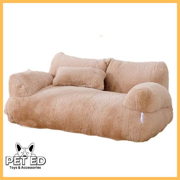 Beige plush pet bed shaped like a sofa with armrests and cushion, cozy dog or cat bedding