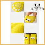 Yellow non-slip dog socks with cute eyes and white grip dots, pet accessories