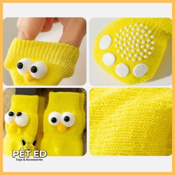 Yellow non-slip dog socks with cartoon eyes, textured paw grips, pet accessories.