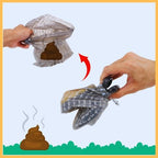 Dog poop scooper tool collecting pet waste with plastic bag outdoors