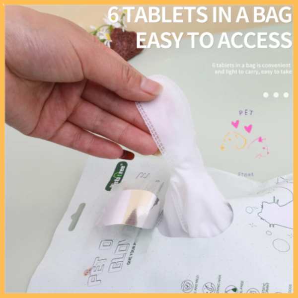 Hand pulling pet wash glove from easy-access package for pet cleaning