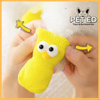 Easy-to-wear yellow non-slip dog sock with cartoon eyes on a pet's paw, PET ED brand