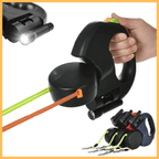 Four LeashMates dog leashes with built-in flashlight, multiple colored leads, ergonomic handle.